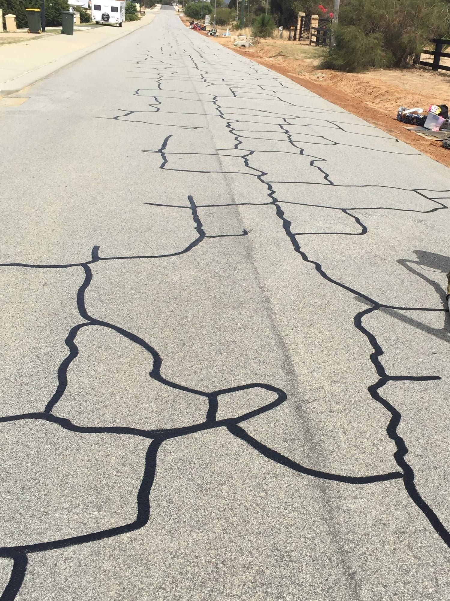 Pro Crack Seal specialists sealing asphalt cracks on site